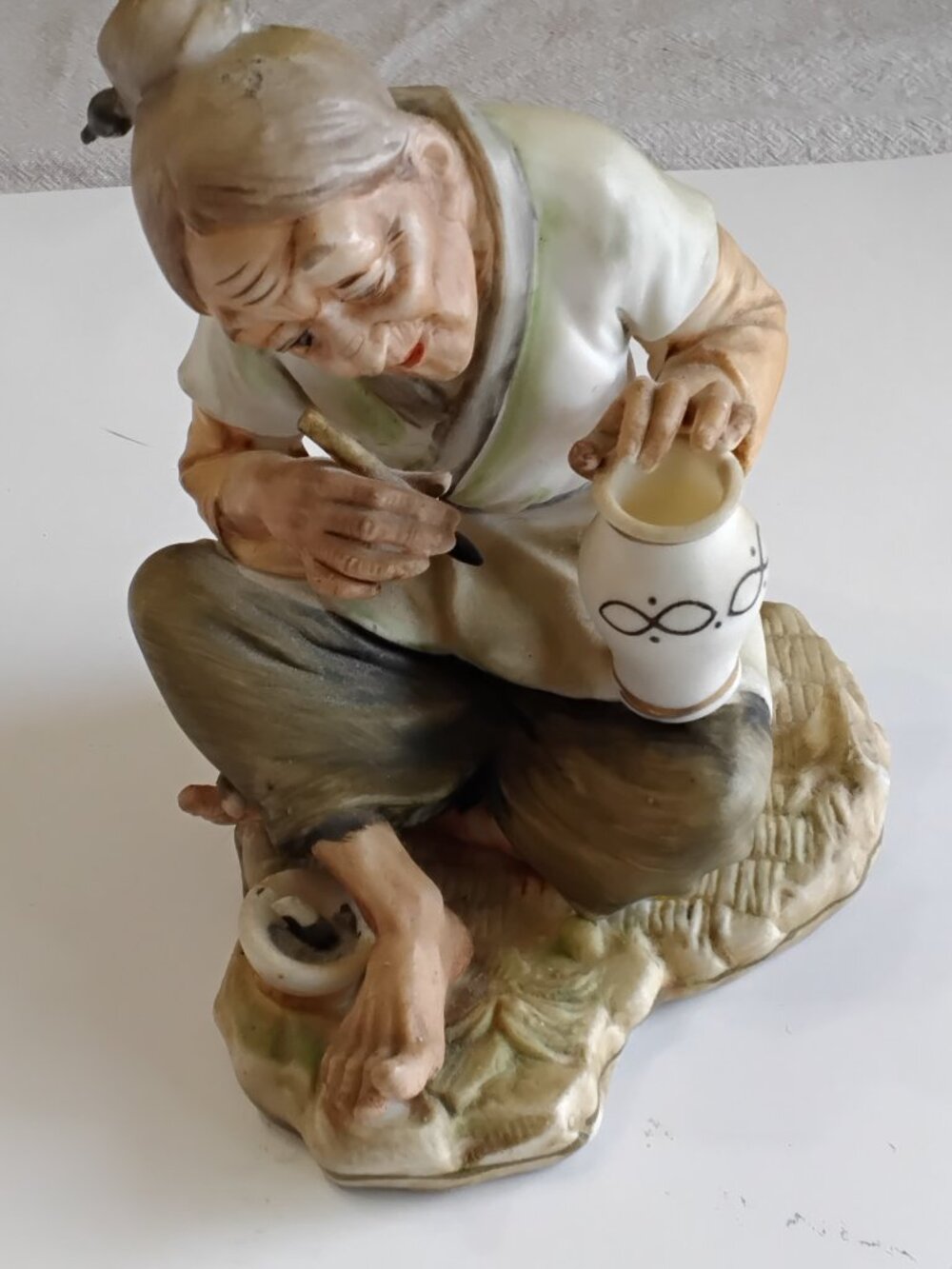 1960s Japanese artisan woman painting a vase.Matte bisque finish.Excellent condi